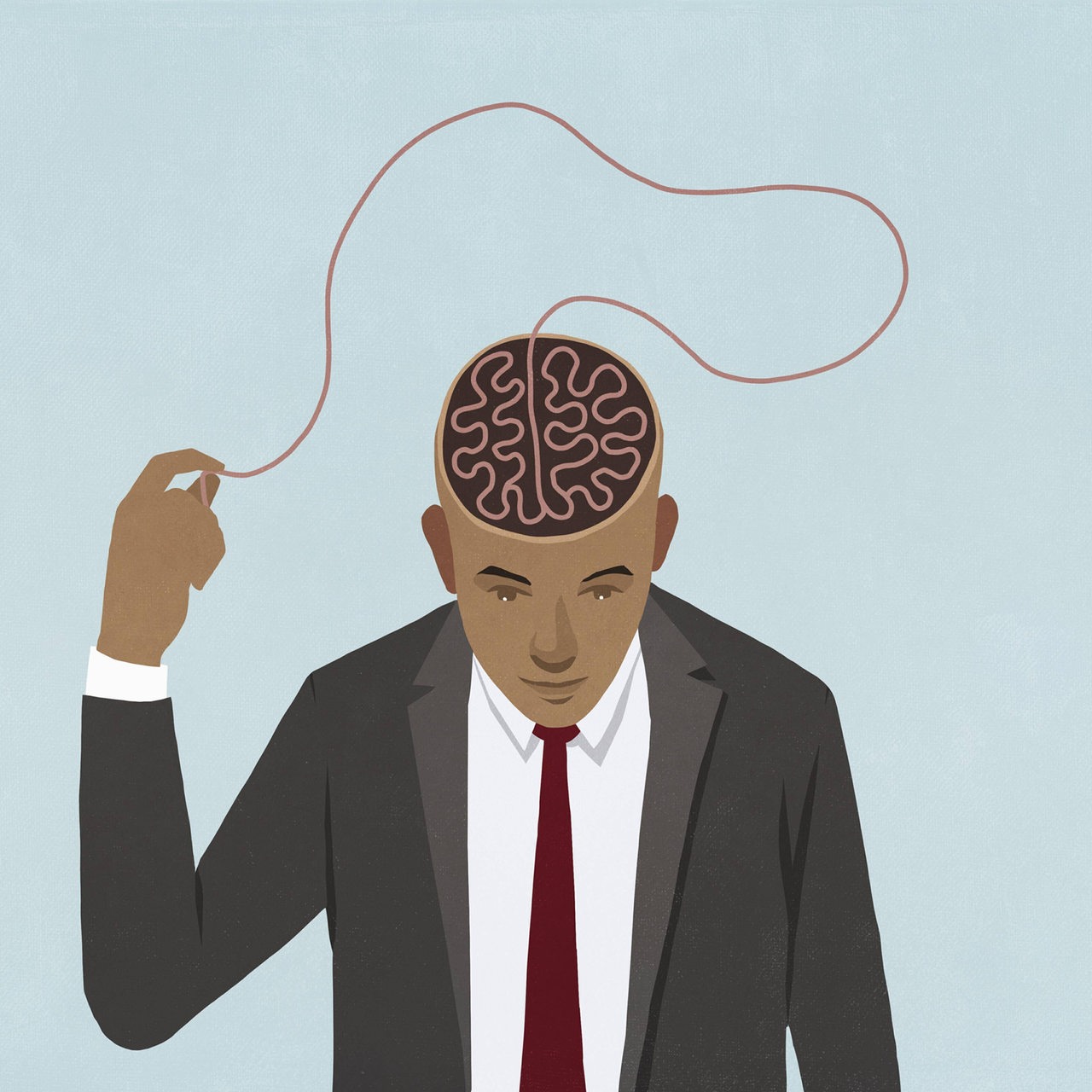 Businessman pulling at brain string